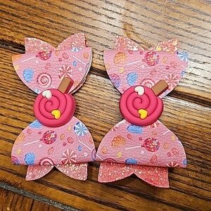 One pair of pink candy land hair bows